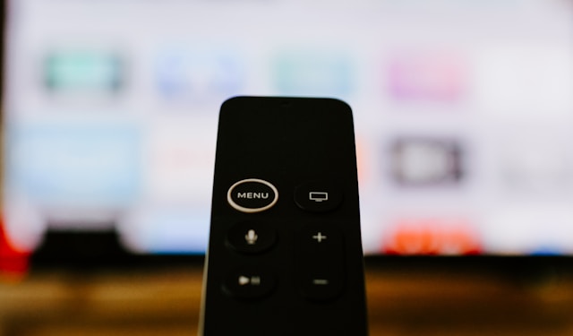 IPTV remote with the IPTV on the background